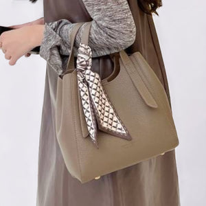 grey leather handbag​